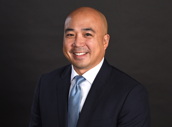 A professional photo of tony lu, director of Pro bono, black background